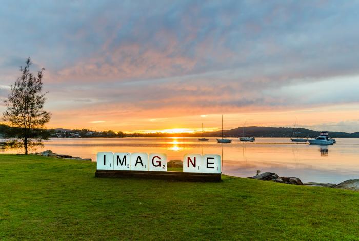 Photograph of Brisbane waters and 'Imagine' public art installation