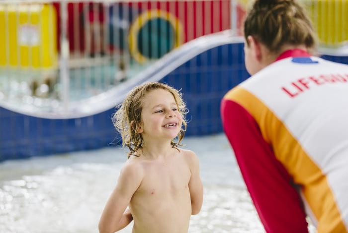 Photo of lifeguard speaking to child at the Peninsula Leisure Centre